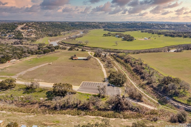 birds eye view of property featuring a rural view