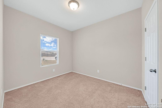 unfurnished bedroom featuring carpet floors and baseboards