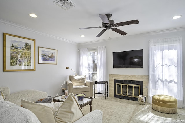 tiled living room with a fireplace with flush hearth, visible vents, and crown molding