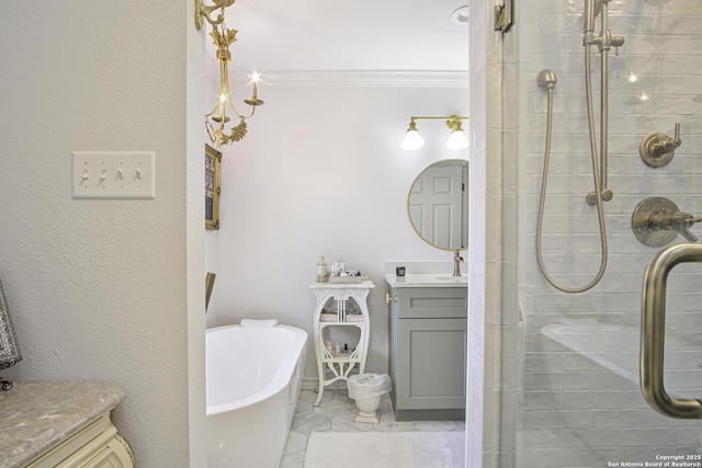 full bath featuring marble finish floor, a soaking tub, ornamental molding, a stall shower, and vanity