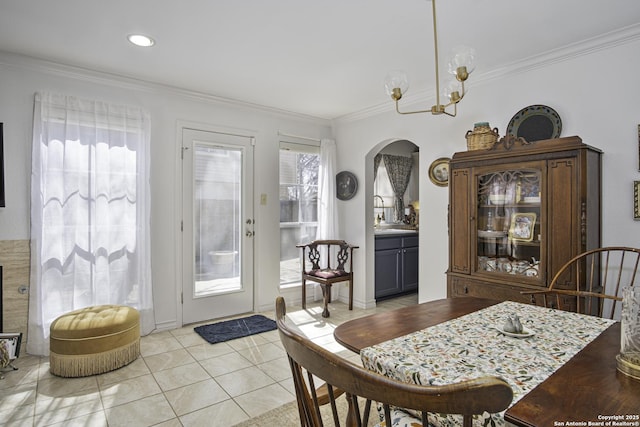 dining room featuring recessed lighting, arched walkways, crown molding, and light tile patterned flooring