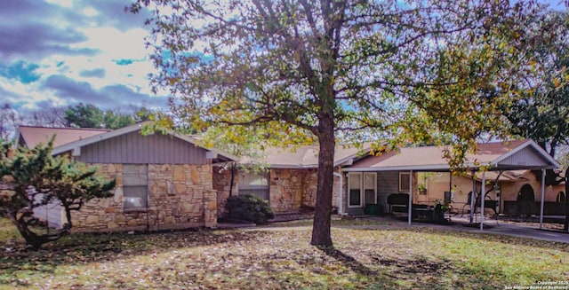 back of property with stone siding