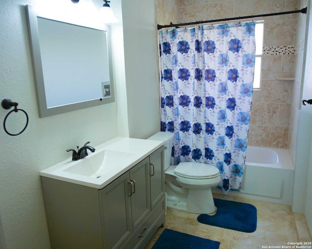 full bathroom featuring shower / tub combo, vanity, and toilet