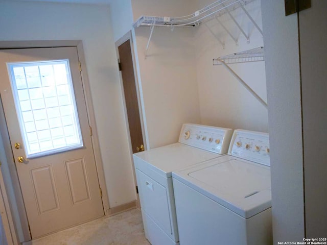 clothes washing area with laundry area and washing machine and clothes dryer