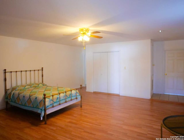 bedroom featuring ceiling fan and wood finished floors