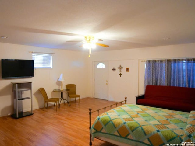 bedroom featuring ceiling fan and wood finished floors