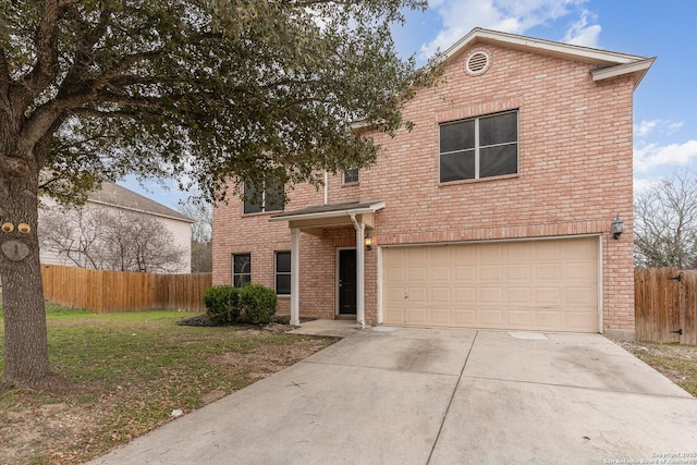 traditional home featuring a garage, brick siding, fence, driveway, and a front yard