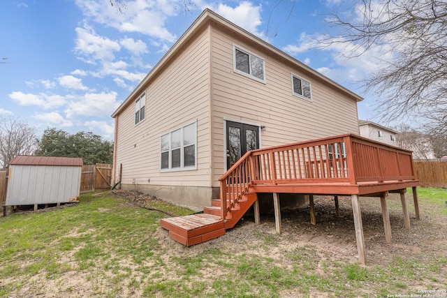 rear view of property featuring a yard, a fenced backyard, a storage unit, and an outbuilding