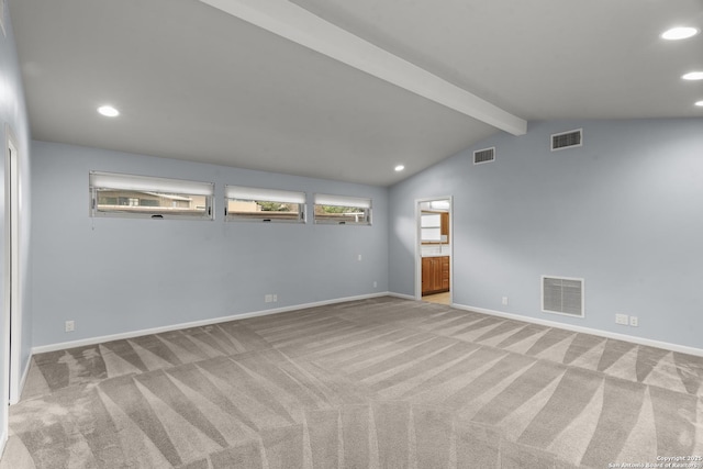 empty room with carpet flooring, visible vents, and baseboards