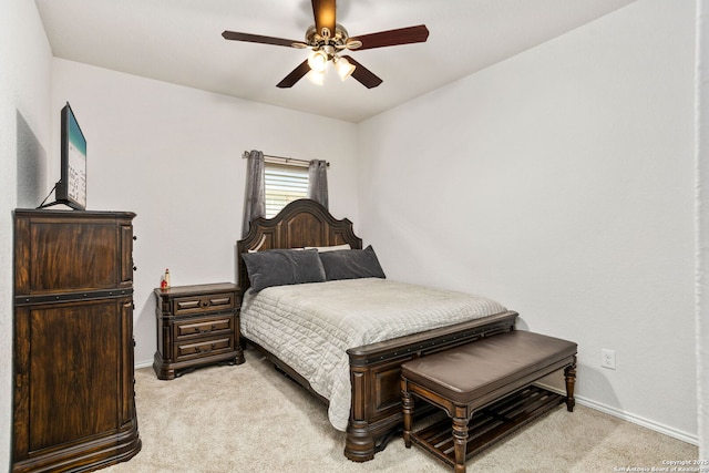 bedroom with baseboards, a ceiling fan, and light colored carpet