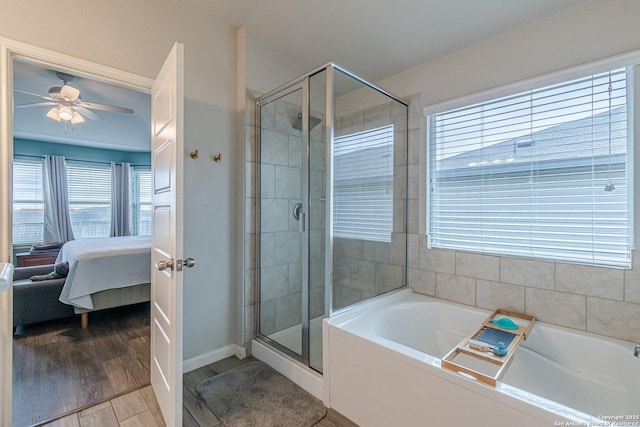 bathroom featuring a stall shower, ceiling fan, wood finished floors, ensuite bathroom, and a garden tub