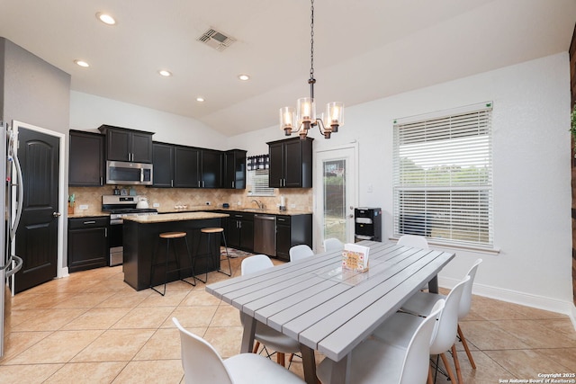 276 Cita Roost, San Antonio, TX 78253 - dining area featuring light tile patterned floors, a chandelier, visible vents, baseboards, and vaulted ceiling