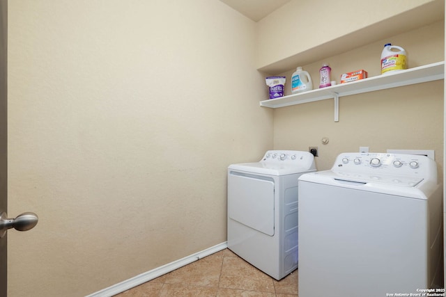 276 Cita Roost, San Antonio, TX 78253 - washroom featuring washing machine and dryer, laundry area, baseboards, and light tile patterned floors