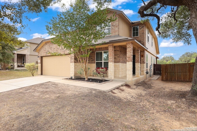 276 Cita Roost, San Antonio, TX 78253 - traditional-style home with a garage, brick siding, fence, concrete driveway, and stone siding