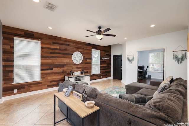 276 Cita Roost, San Antonio, TX 78253 - living area with light tile patterned flooring, recessed lighting, an accent wall, wood walls, and visible vents