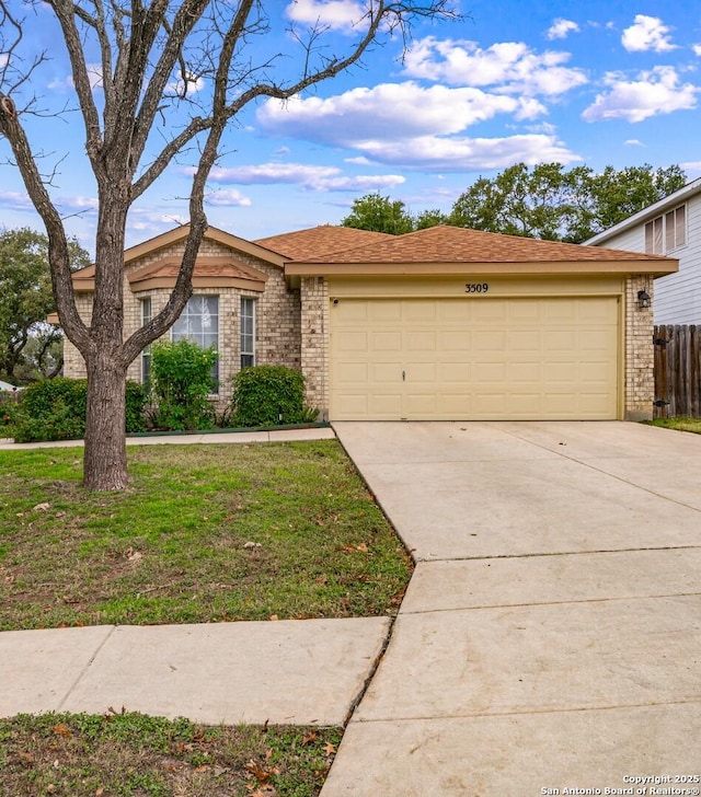 ranch-style house featuring brick siding, an attached garage, fence, driveway, and a front lawn