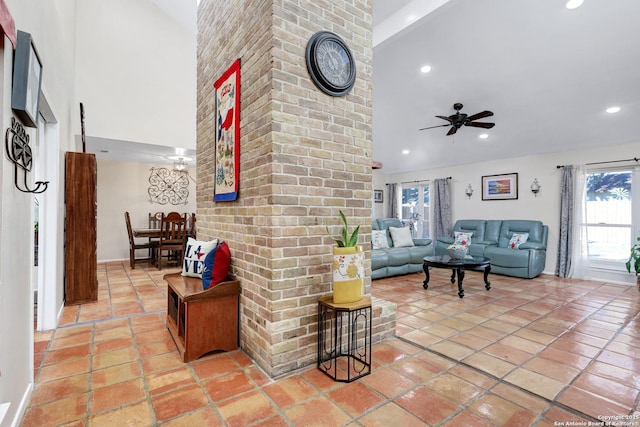 interior space with light tile patterned floors, a towering ceiling, a ceiling fan, and recessed lighting