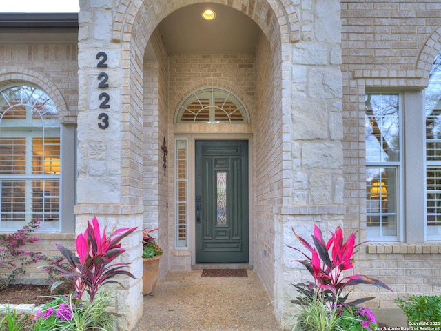 entrance to property with brick siding