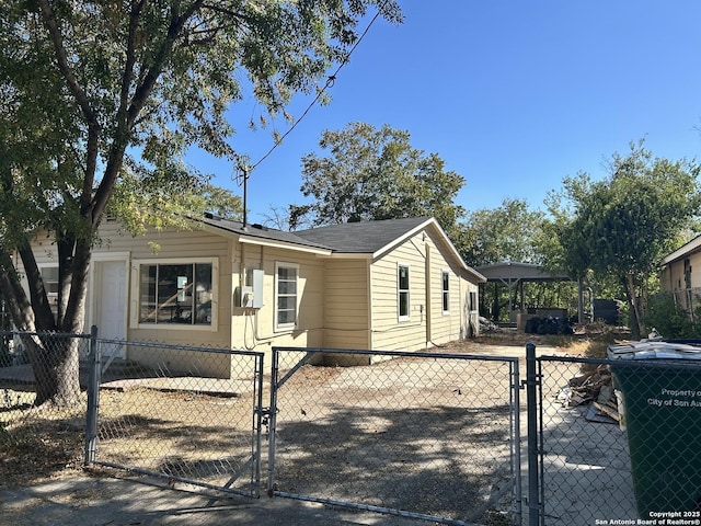 view of front facade with a fenced front yard and a gate