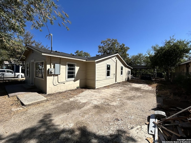 view of side of property featuring concrete block siding