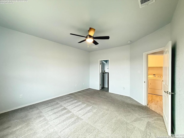 unfurnished bedroom with carpet floors, visible vents, baseboards, a ceiling fan, and a spacious closet