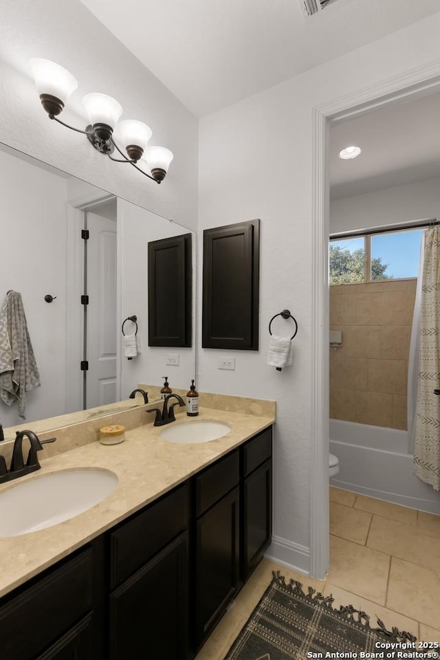 full bathroom featuring tile patterned flooring, a sink, shower / bath combo with shower curtain, and double vanity