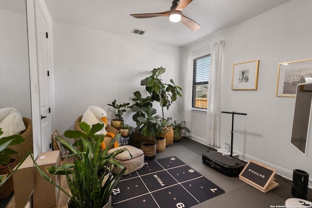 sitting room featuring ceiling fan, visible vents, and baseboards