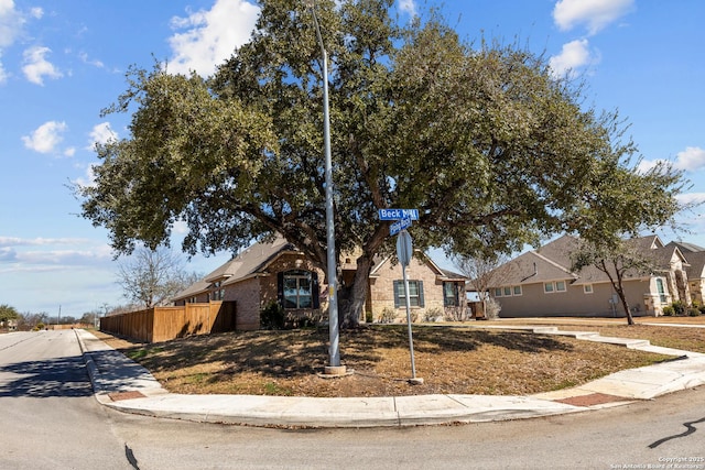 view of front of house with fence