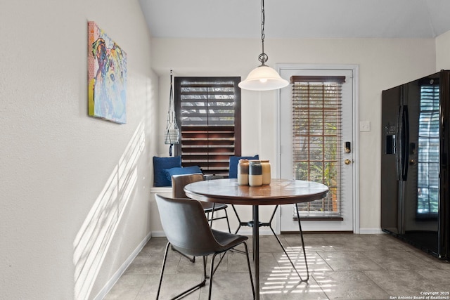 dining area featuring baseboards