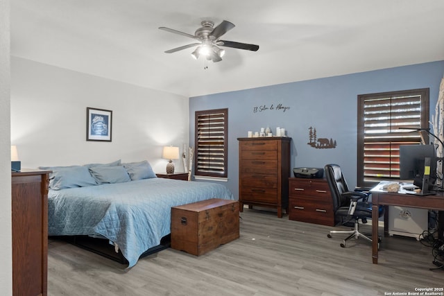 bedroom featuring a ceiling fan and wood finished floors