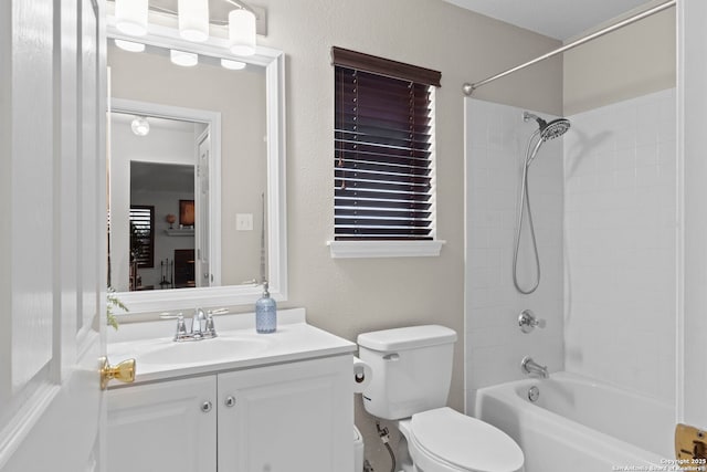 full bath featuring washtub / shower combination, vanity, and toilet