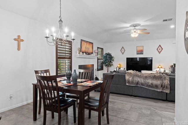 dining area featuring visible vents, baseboards, and ceiling fan with notable chandelier