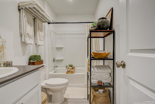 bathroom featuring toilet, wood finished floors, shower / bath combination with curtain, and vanity