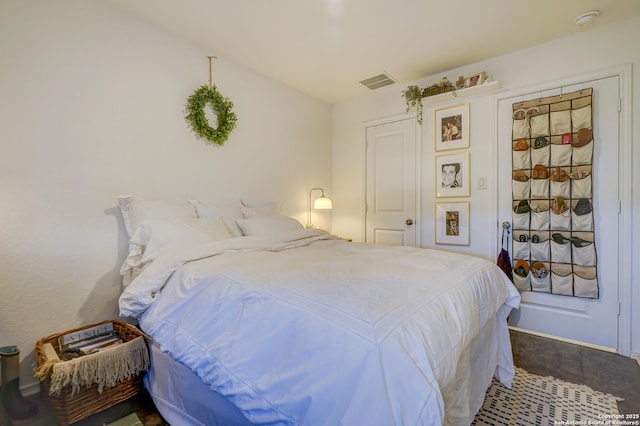 bedroom with visible vents and baseboards