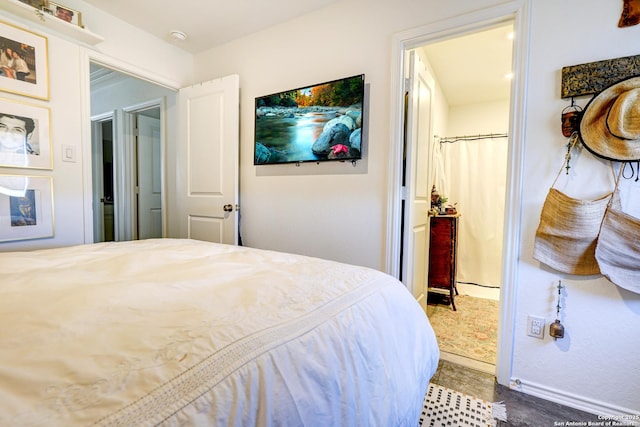 bedroom with wood finished floors