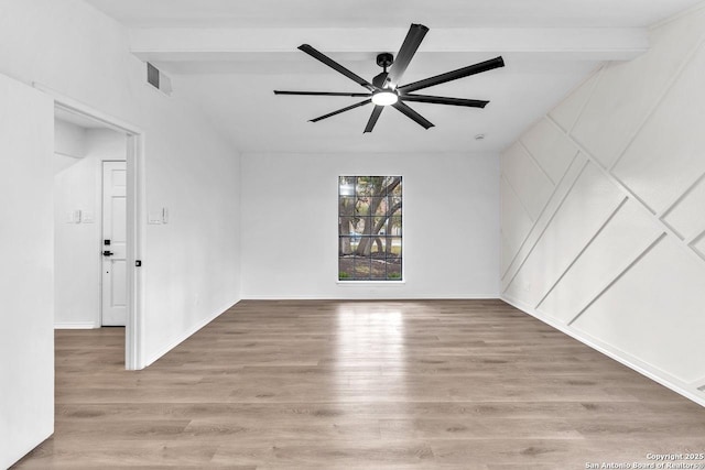 empty room with a ceiling fan, light wood-type flooring, beam ceiling, and visible vents