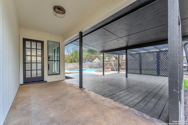 deck featuring a lanai, a patio area, a fenced backyard, and a fenced in pool