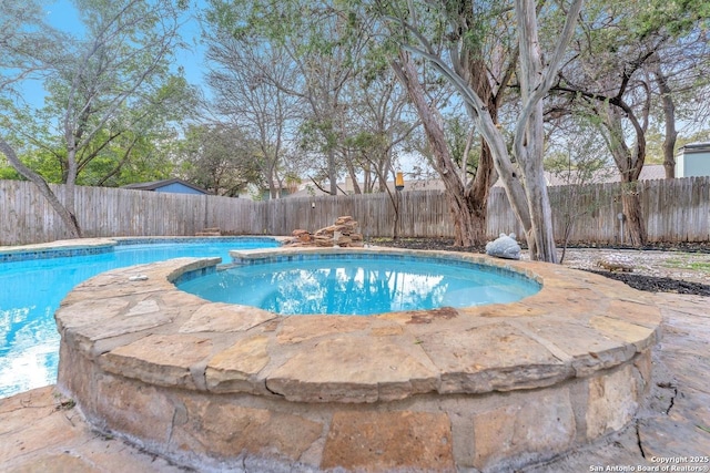 view of swimming pool with a fenced backyard and a fenced in pool