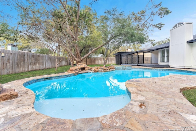 view of swimming pool with a fenced backyard and a fenced in pool