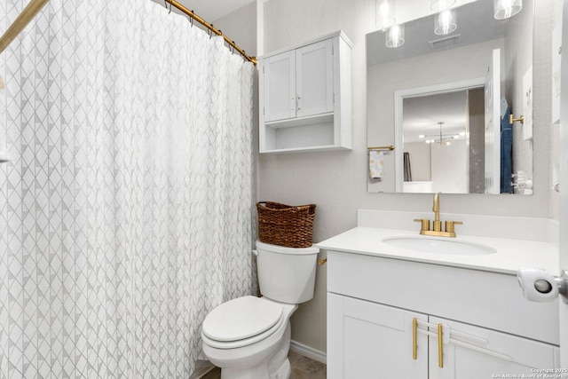 bathroom featuring a shower with shower curtain, visible vents, vanity, and toilet