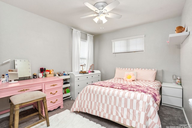 bedroom featuring light carpet and a ceiling fan