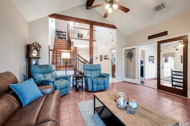 tiled living room featuring visible vents, ceiling fan, stairway, beamed ceiling, and french doors