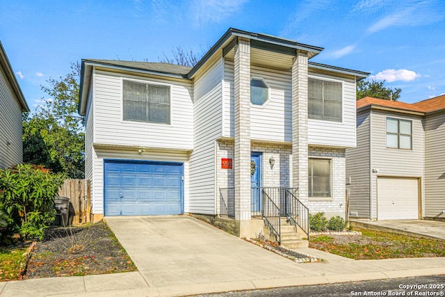 multi unit property featuring concrete driveway, brick siding, and an attached garage