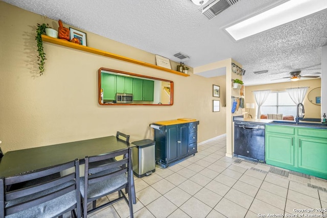 kitchen with light tile patterned floors, visible vents, a ceiling fan, a sink, and dishwasher