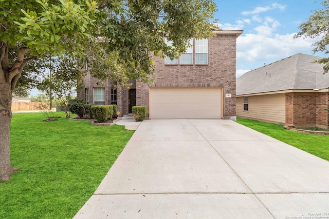 traditional-style home featuring a garage, driveway, brick siding, and a front yard