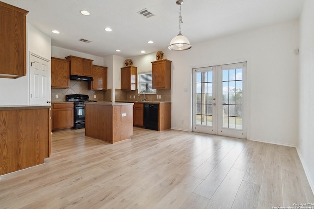 kitchen with a sink, visible vents, french doors, black appliances, and brown cabinetry