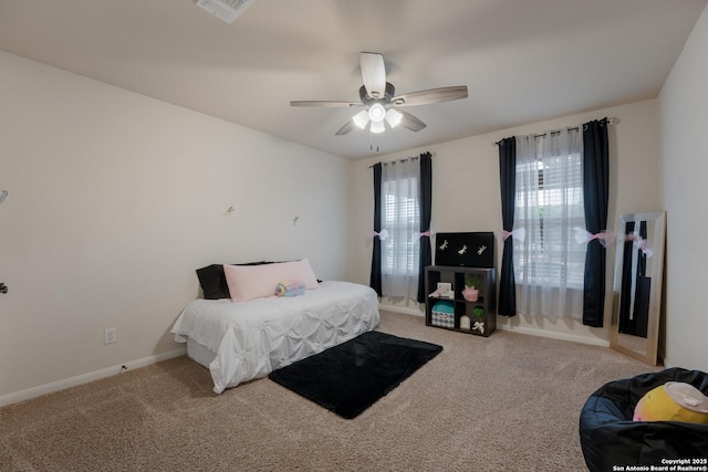 bedroom featuring carpet flooring, ceiling fan, visible vents, and baseboards