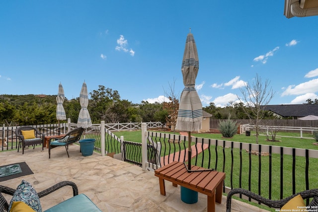 view of patio / terrace featuring fence