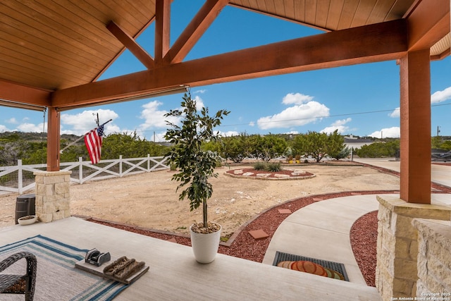 view of patio featuring fence