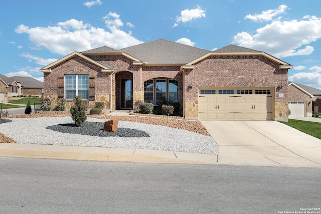 view of front of house with a garage, concrete driveway, brick siding, and a shingled roof